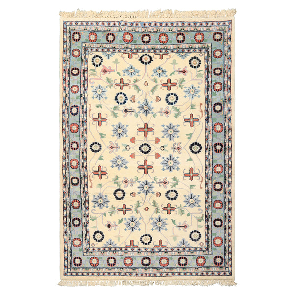Ivory Indo-Kashan hand-knotted wool rug 5'5''x8'6'' with soft blue, mint, and sage floral vines — classic oriental rug for living room décor