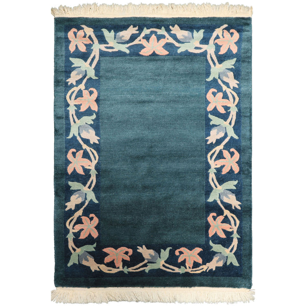 4x6 teal Tibetan hand knotted wool rug with navy, mint, blush, and peach floral border.